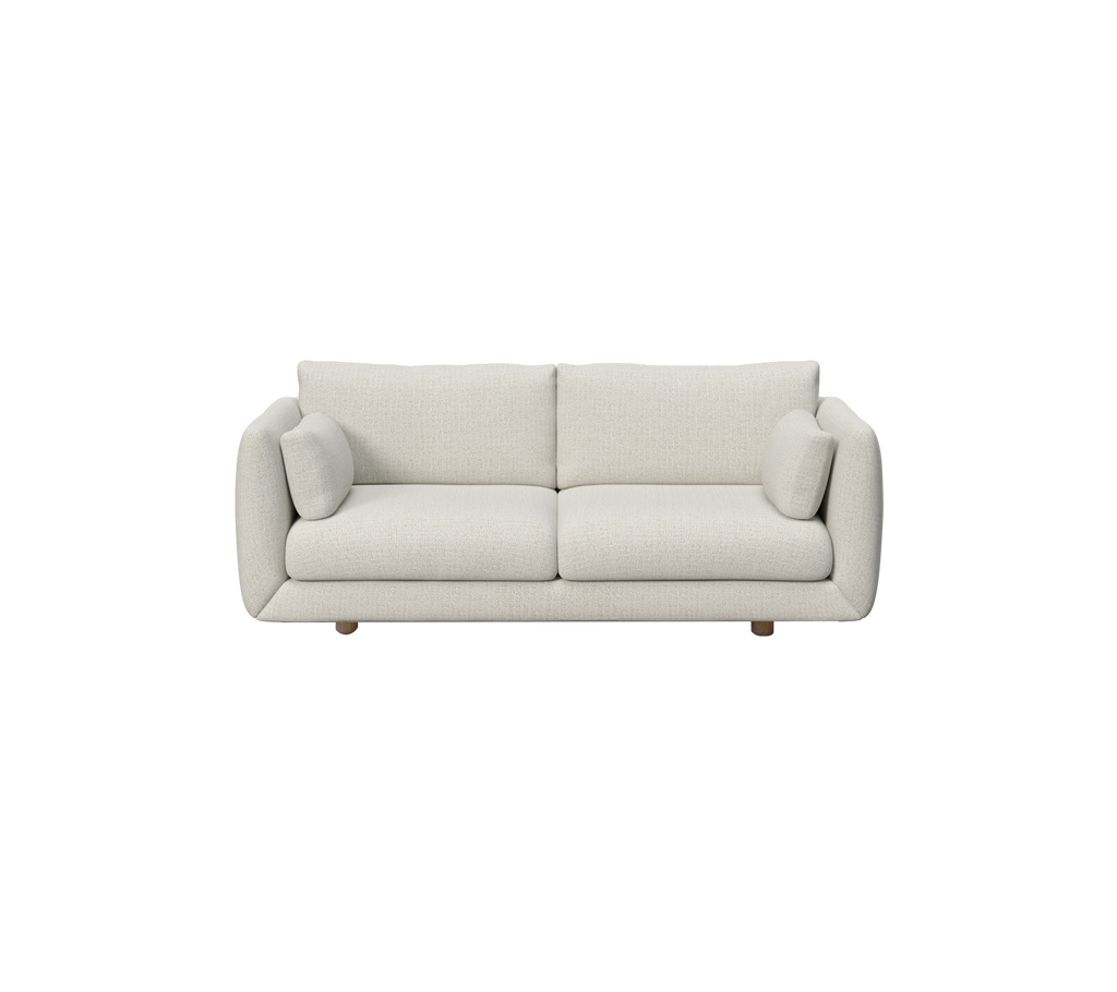 Moderne zandsofa met ronde kussens en houten poten.