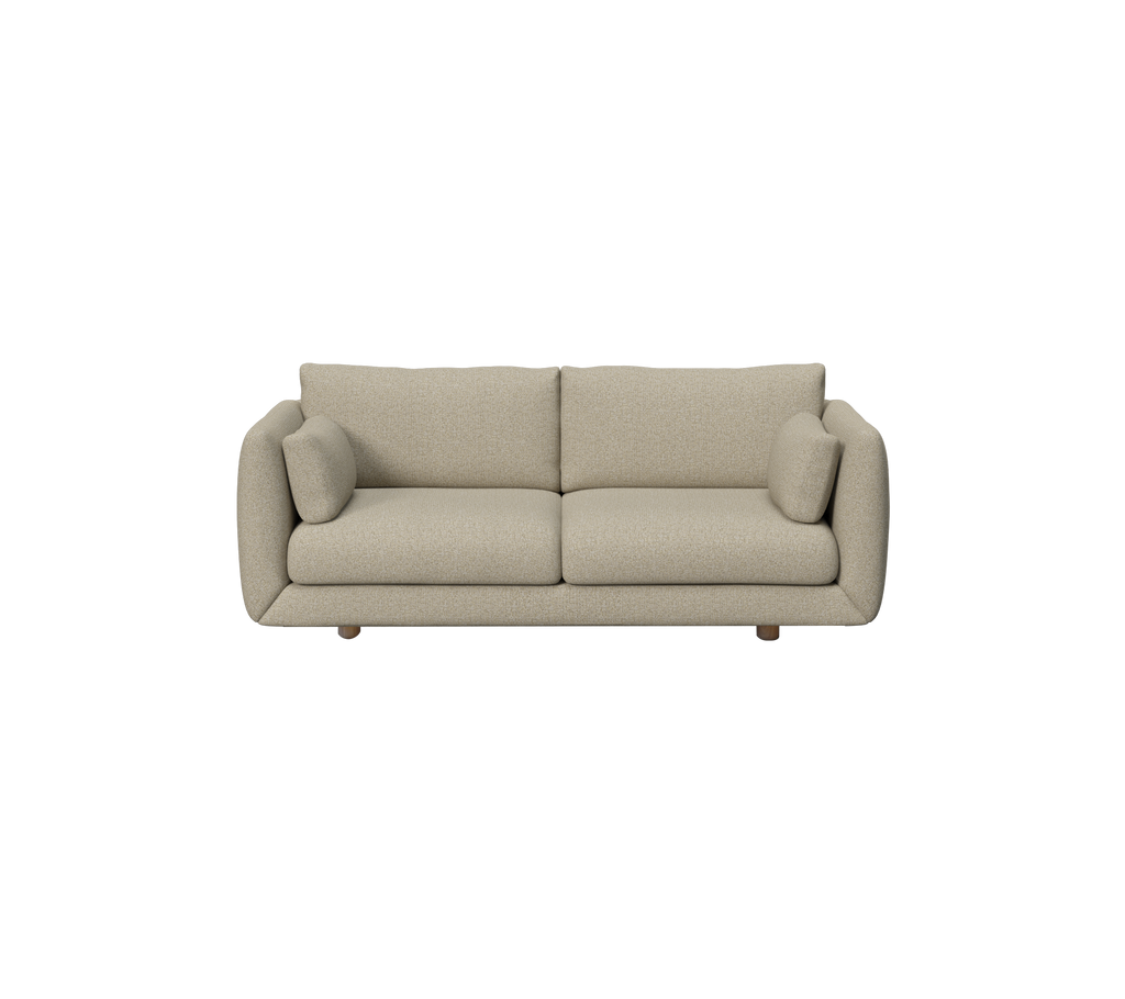 Moderne bruine bank met ronde kussens in een lounge setting.