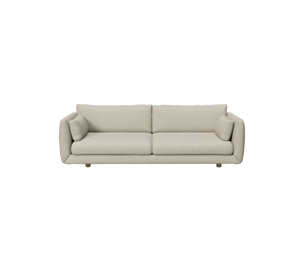 Moderne lichtbruine bank met ronde kussens in een minimalistisch ontwerp.