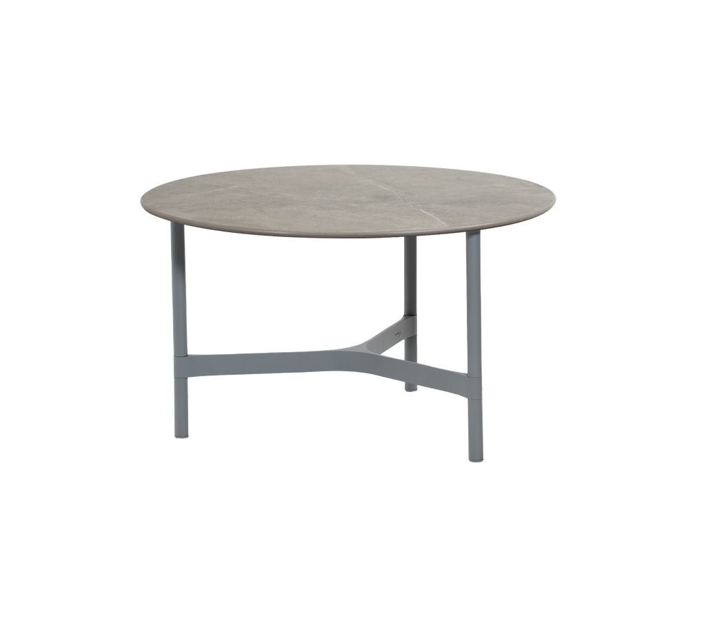 Ronde grijze tafel met een lichte frame.