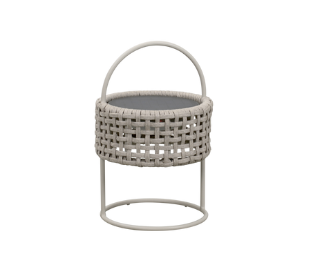 Woven round basket with a handle, resting on a minimal metal stand, perfect for storage or decorative use.