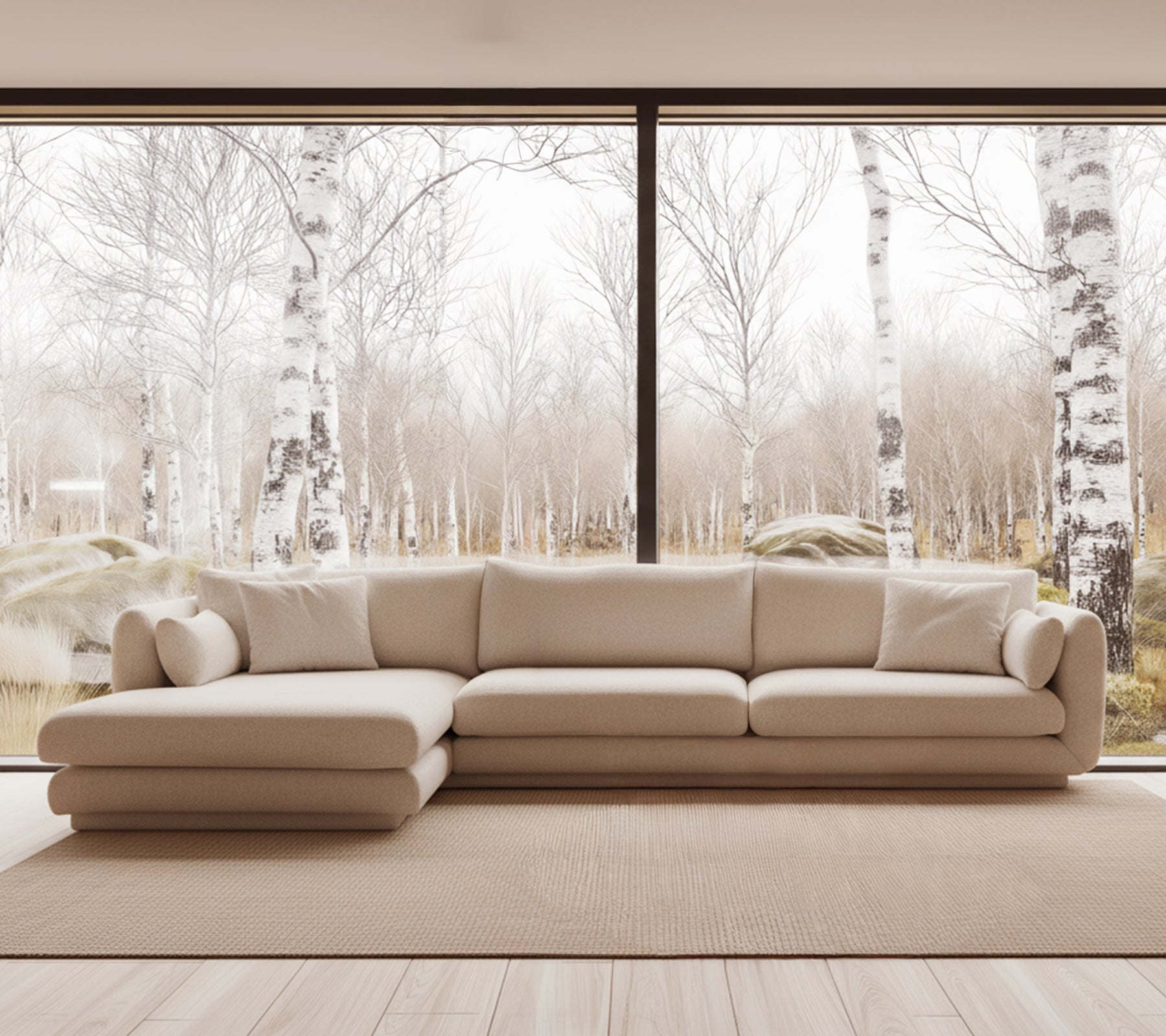 Beige moderne bank in een lichte lounge-instelling met grote ramen.