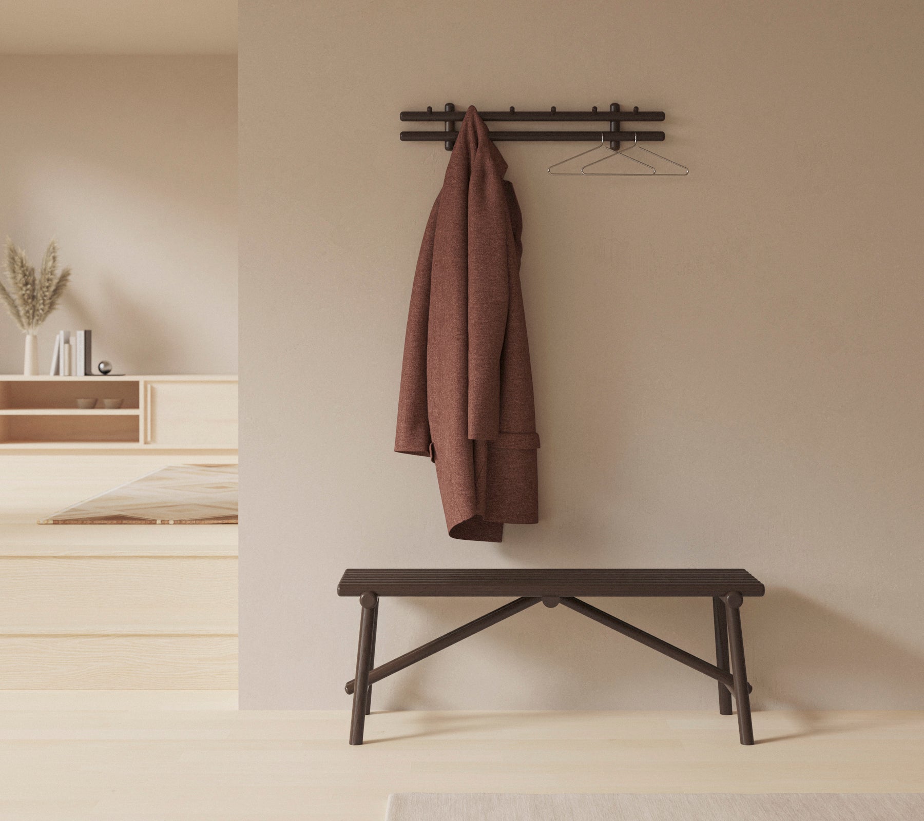 Een minimalistische inrichting met een houten bank en een jas die aan een wandbevestigde rek hangt, waarmee de eenvoud en functionaliteit van de ruimte wordt verbeterd.